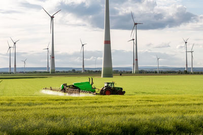 Scenic view of agricultural field against sky