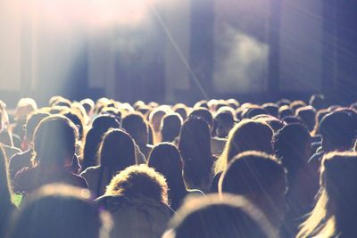 People enjoying music concert at night