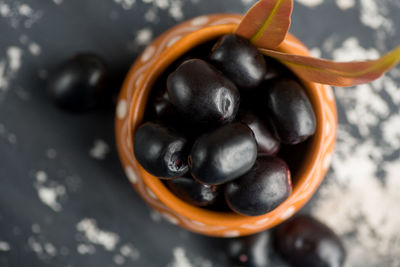 High angle view of blueberries in bowl on table