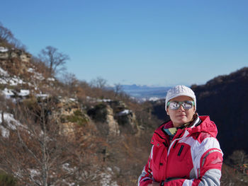 Woman with snowy mountains and campoo valley in the background