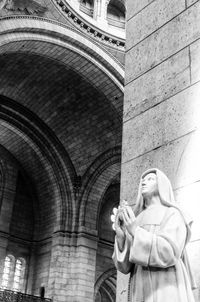 Low angle view of statue against building
