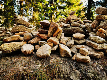 Close-up of stack of stones on field