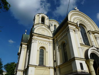 Low angle view of bell tower against sky