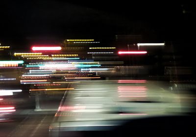 View of illuminated road at night