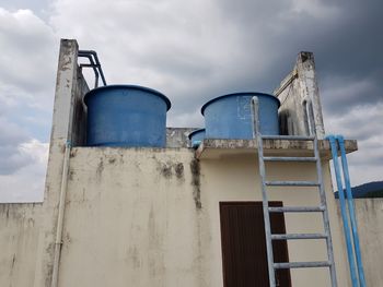 Low angle view of water tower against sky