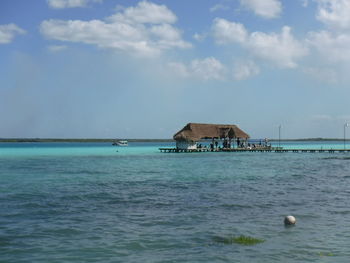 House by sea against sky