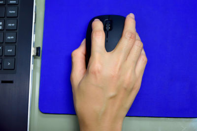 Cropped image of woman hand holding computer mouse 