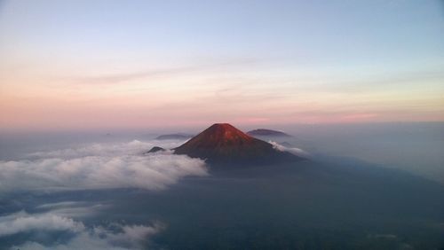 View of volcanic landscape against sky during sunset