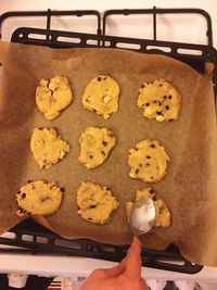 High angle view of hand holding cookies