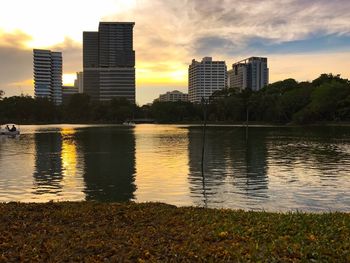 View of city at waterfront during sunset