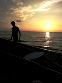 Scenic view of sea at sunset