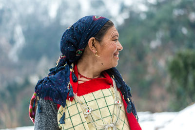 Woman looking away in snow