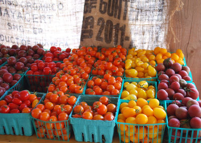 Various fruits in basket at market stall