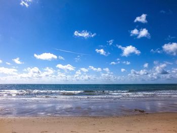 Scenic view of sea against blue sky