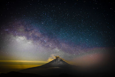 Scenic view of star field against sky at night