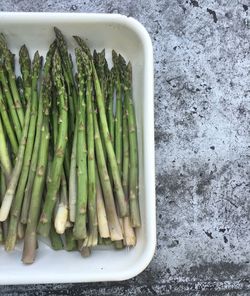 High angle view of asparagus in container on table