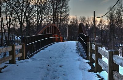 Bridge over snow covered landscape