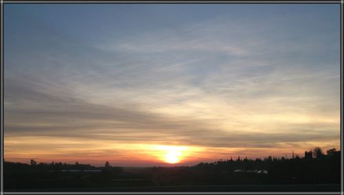 Scenic view of landscape at sunset