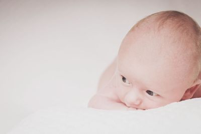 Cute baby lying on bed