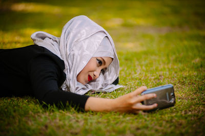 Girl playing on grassy field