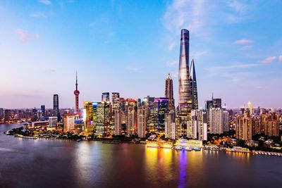 Illuminated city at waterfront