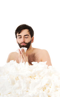 Portrait of man holding white flower