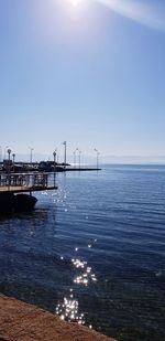 Pier over sea against clear sky