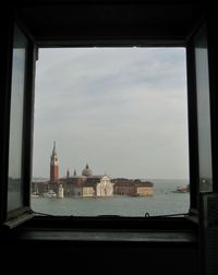 View of sea with buildings in background