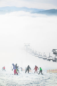 People on snow covered landscape