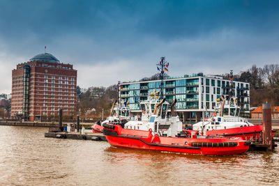 Tugboats docked at the hamburg port on the banks of the elbe river