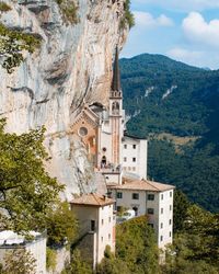 Buildings against mountain range