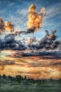 Scenic view of landscape against sky during sunset