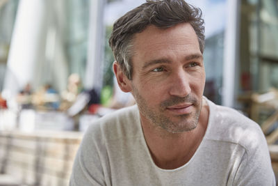 Portrait of man at an outdoor cafe