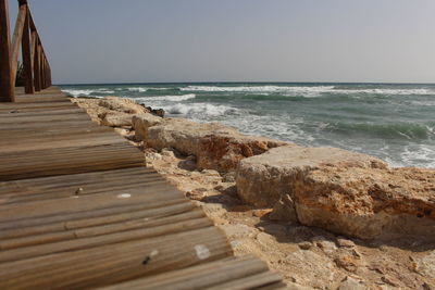 Scenic view of beach against clear sky