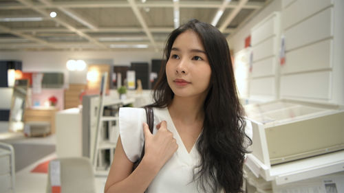 Portrait of beautiful woman in a room