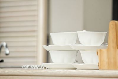 Bowls and plates on table in kitchen