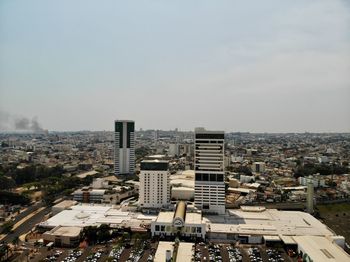 High angle view of buildings in city against sky