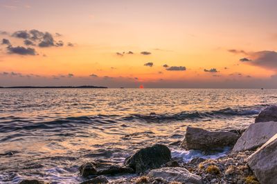 Scenic view of sea against sky during sunset