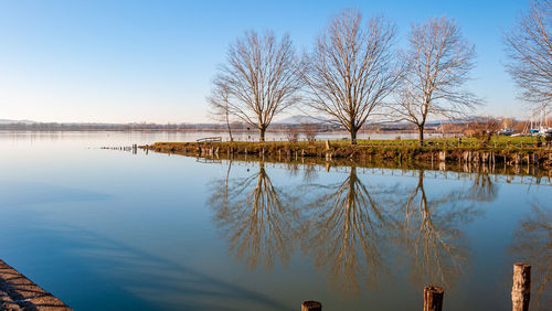 Scenic view of lake against blue sky