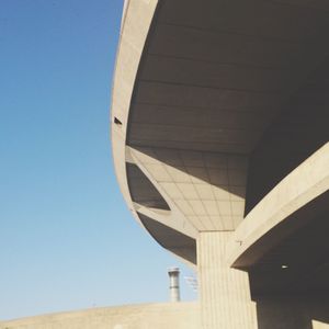 Low angle view of built structure against clear blue sky