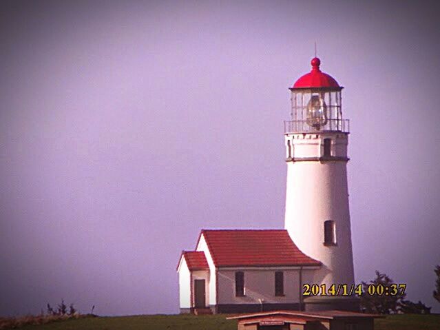 LIGHTHOUSE AGAINST SKY AT DUSK