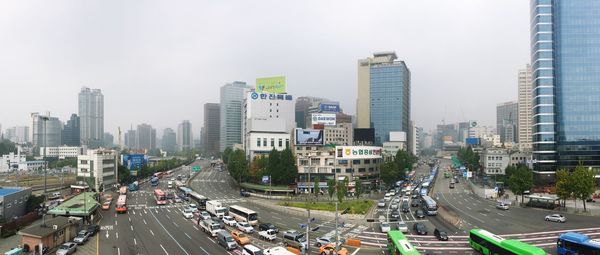 High angle view of city street and buildings against sky