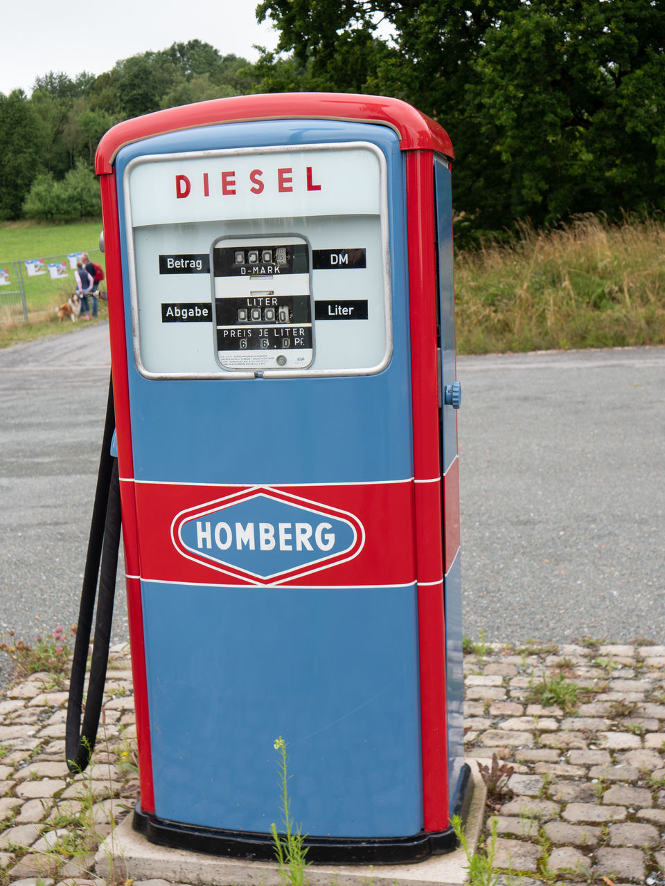 text, communication, day, western script, red, refueling, gas station, no people, transportation, outdoors, nature, road, fuel and power generation, fuel pump, gasoline, mode of transportation, fossil fuel, number, sign, information