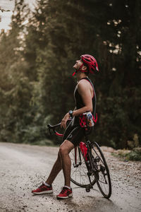 Woman riding bicycle on road