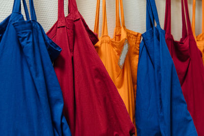 Multi colored bags hanging on wall