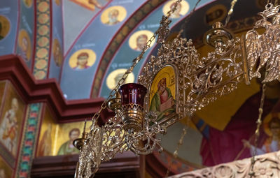 Low angle view of decoration hanging on ceiling in building