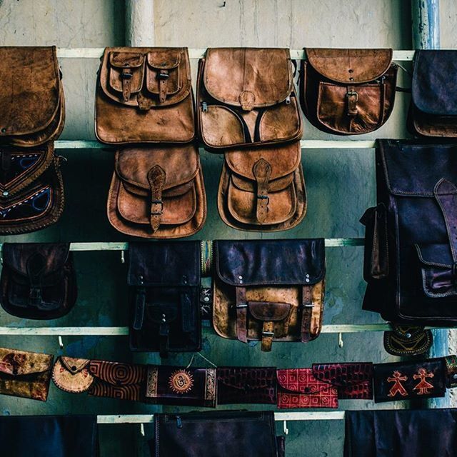 large group of objects, for sale, retail, abundance, variation, choice, arrangement, order, in a row, display, indoors, store, side by side, market, shelf, market stall, still life, stack, repetition, business