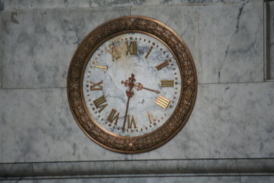 Close-up of clock on wall