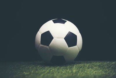 Close-up of soccer ball on playing field