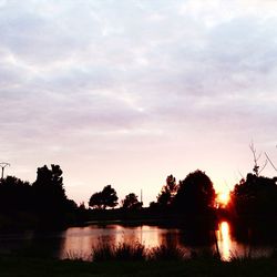 Scenic view of river at sunset